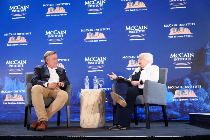Janet Yellen sits on stage with ASU President Michael Crow during a McCain Institute panel