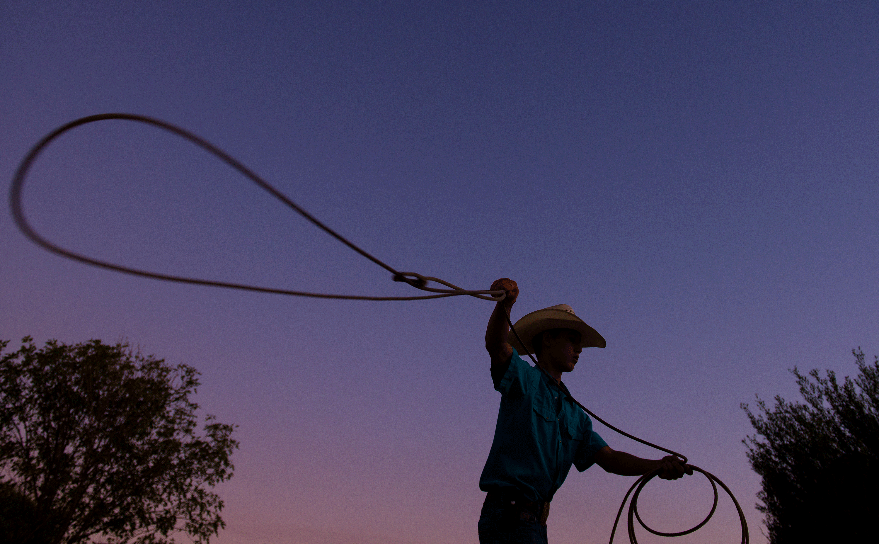 Hunter Kelley swings a rope