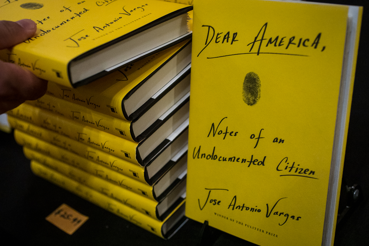 pile of books titled "Dear America, Notes of an Undocumented Citizen"