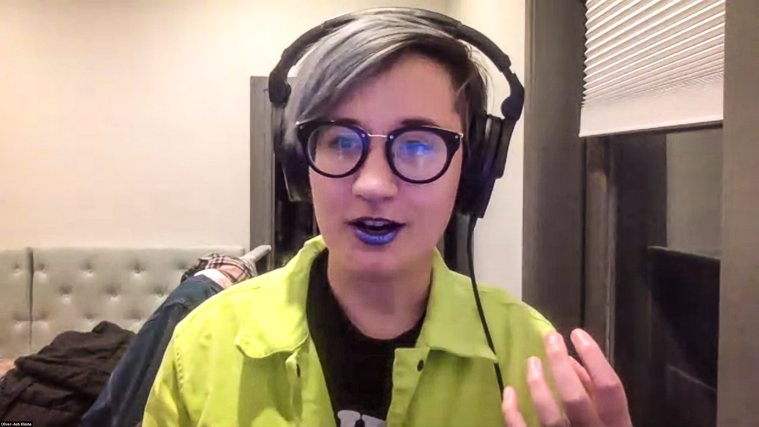 Trans person wearing headphones
