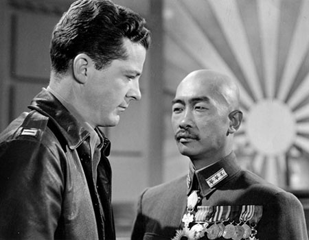 A white man and an Asian man in a scene from the 1944 movie The Purple Heart