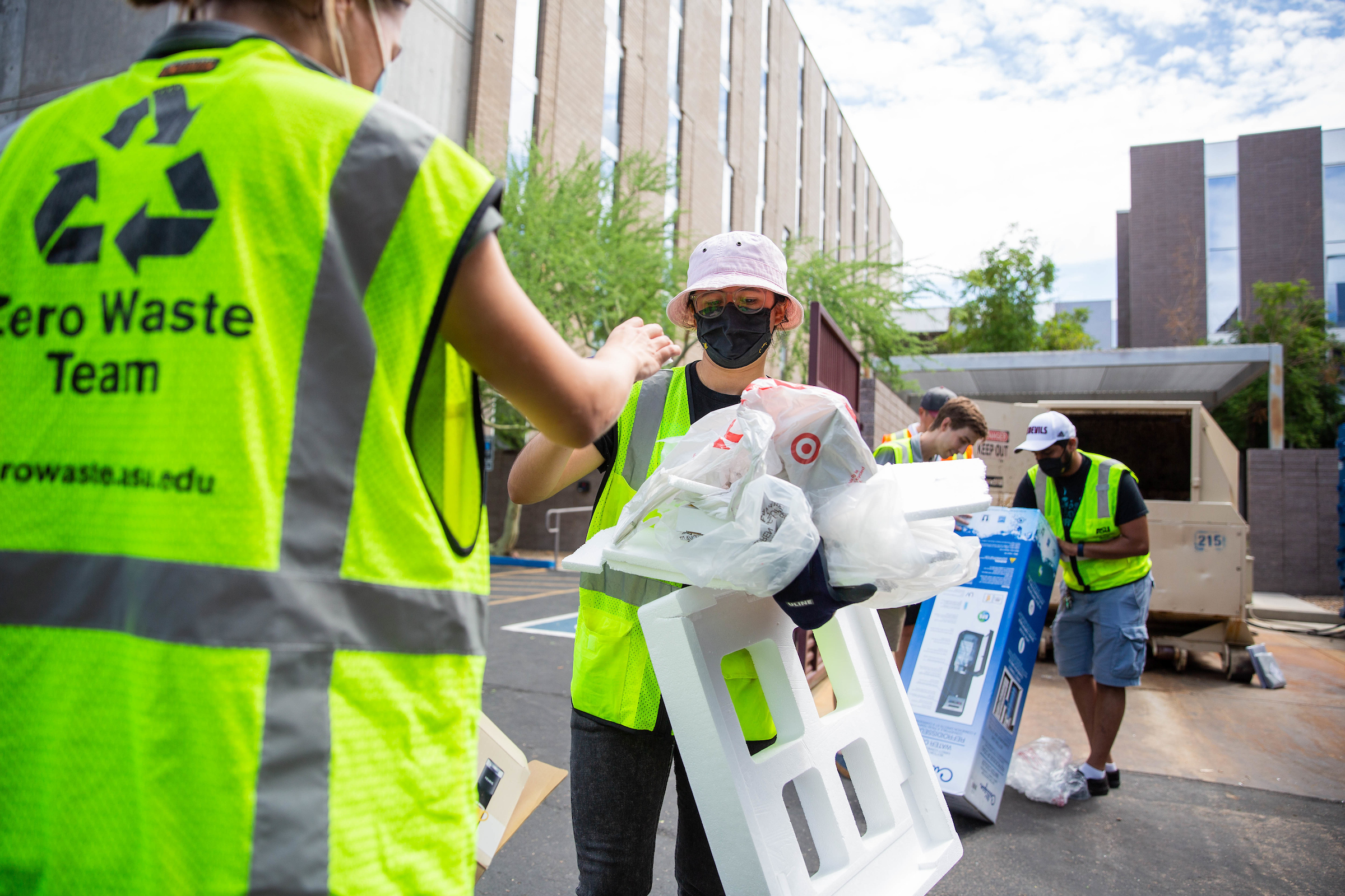 volunteers separating recyclables 