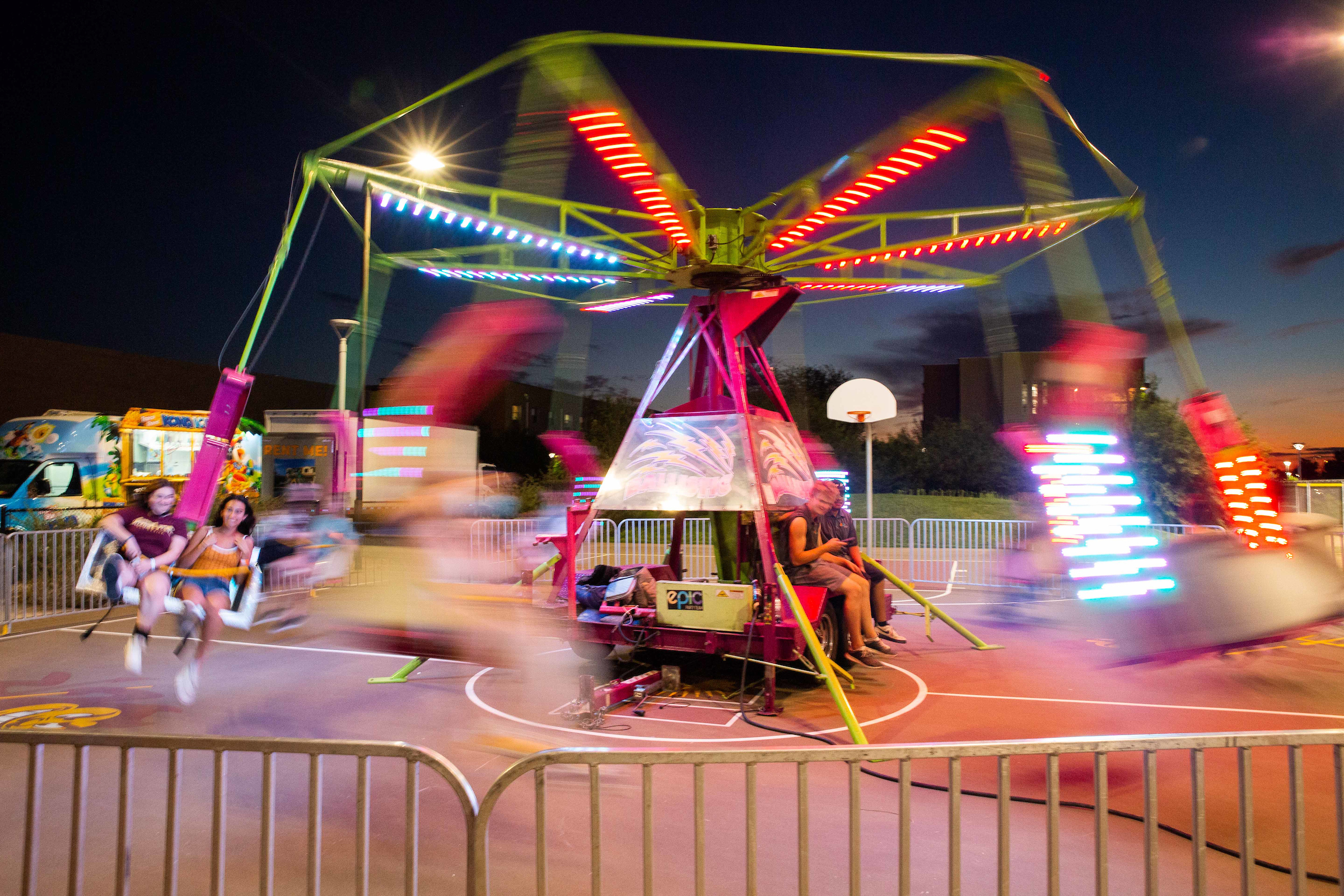 students ride on a carnival ride