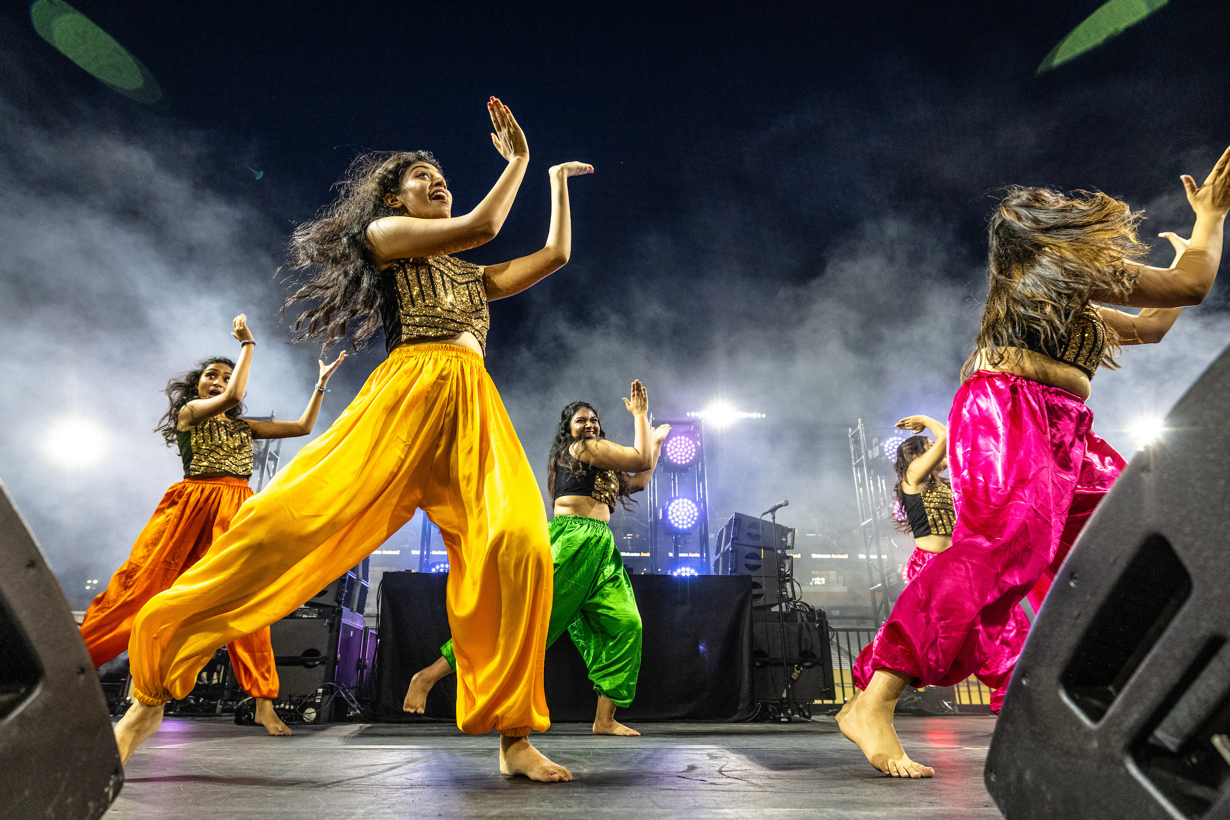 Bollywood dancer team performing on stage