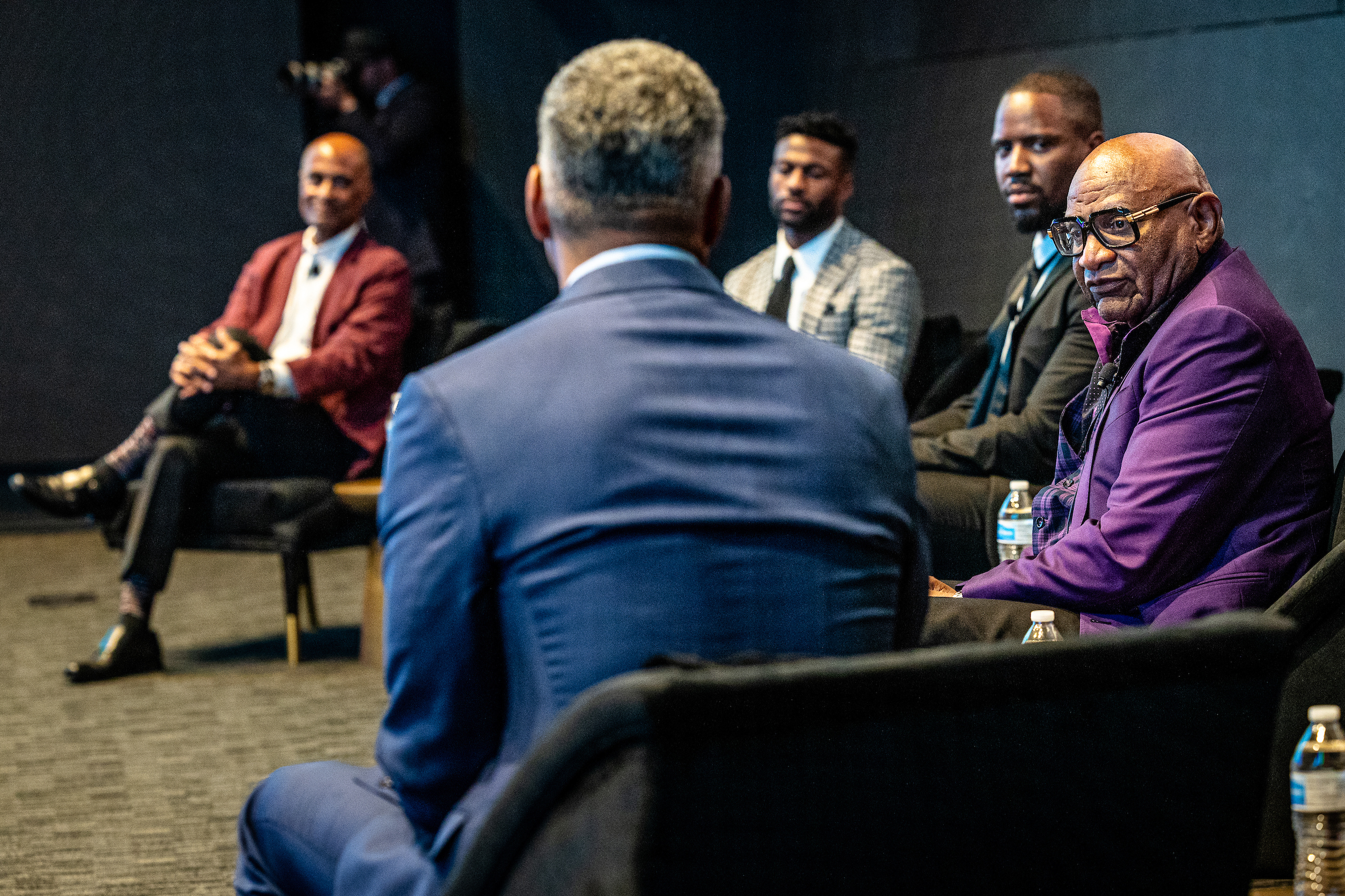 Group of Black men on stage for panel discussion