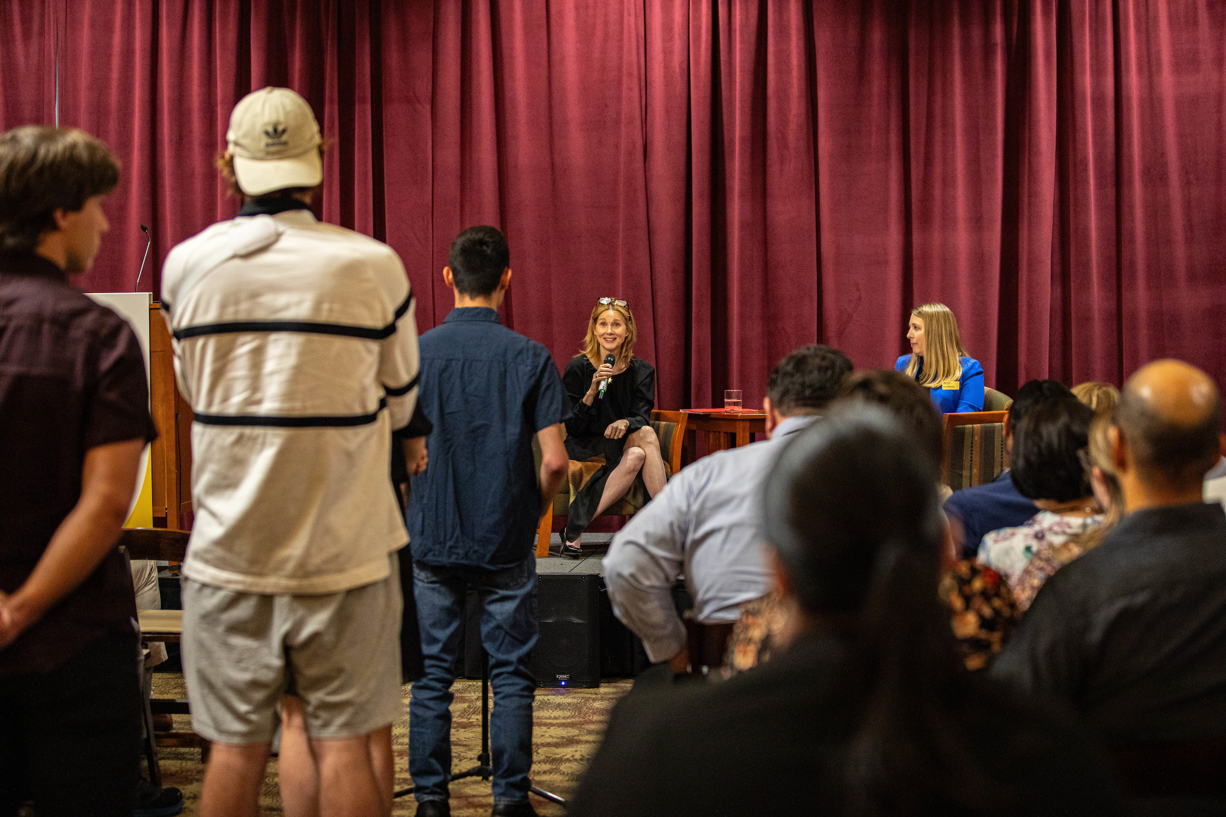 People lining up to ask a question during a Q&amp;A