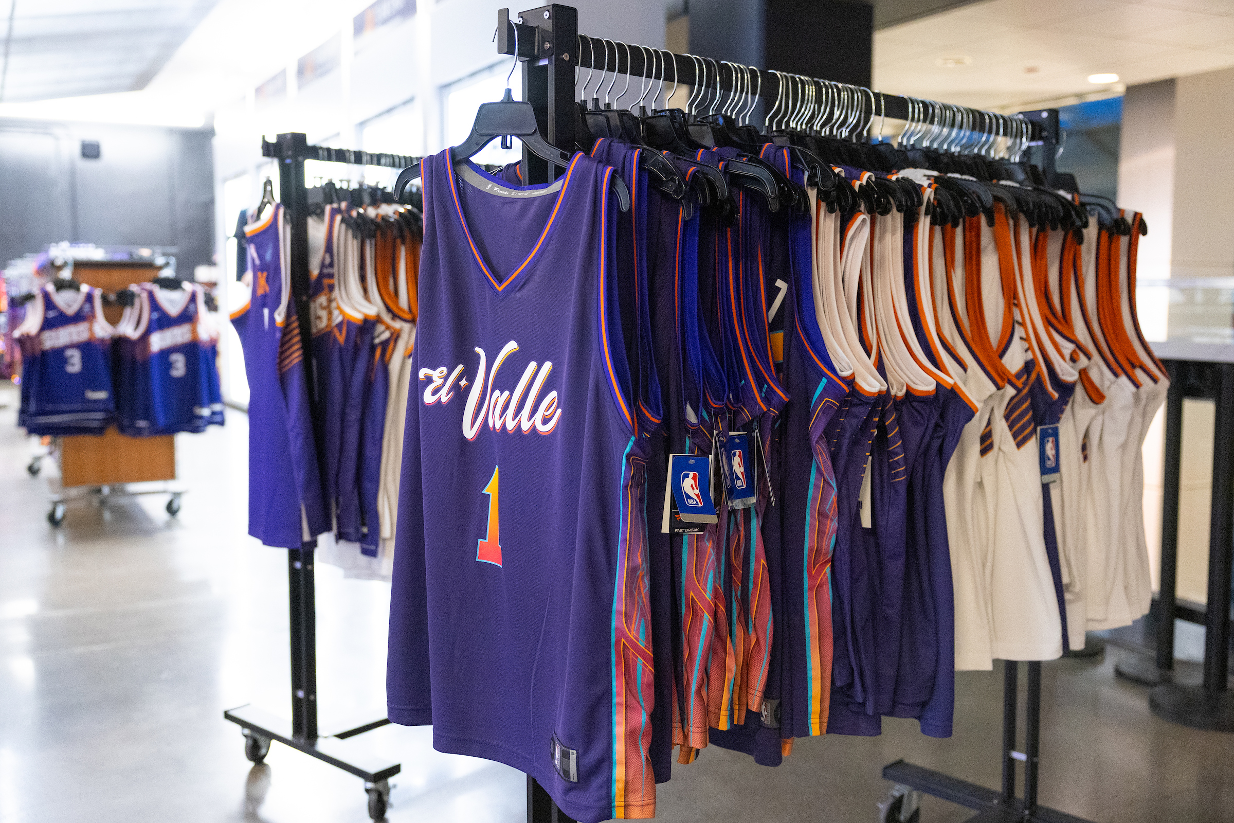 El Valle jerseys hanging on racks at Footprint Center
