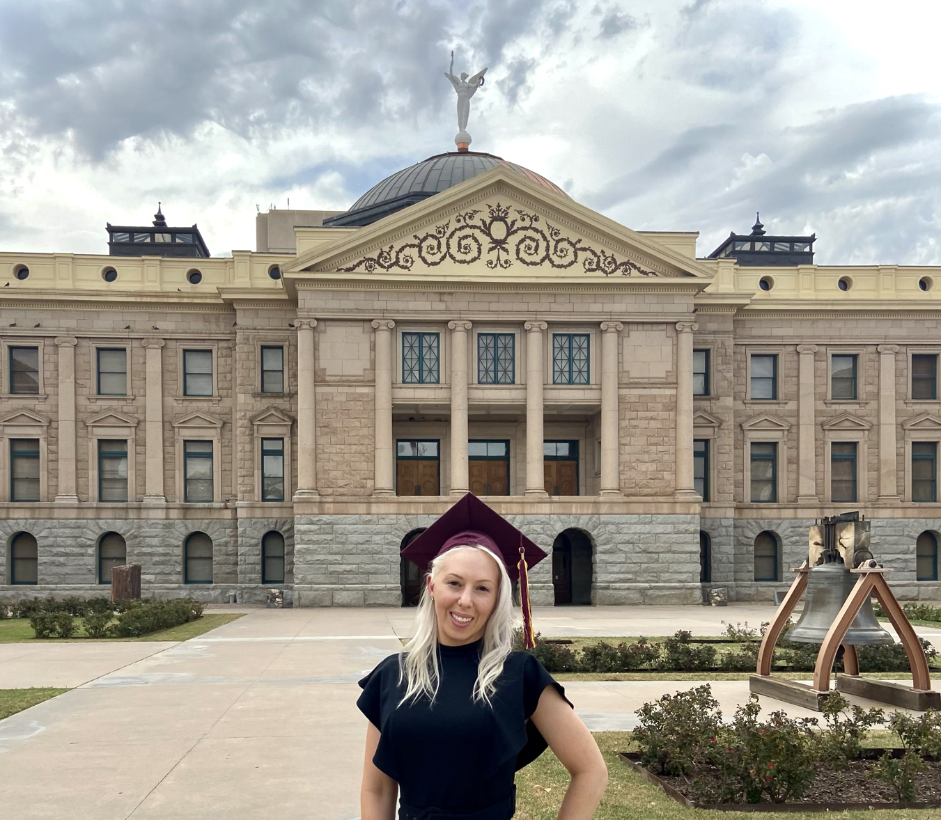 woman standing in front of Arizona capitol building