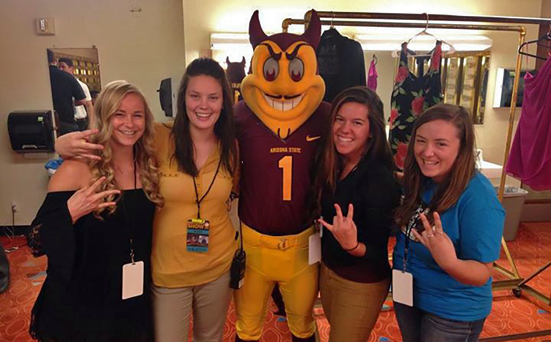 Photo of Lichterman and classmates celebrating the planning of ASU's 2014 Homecoming Dance