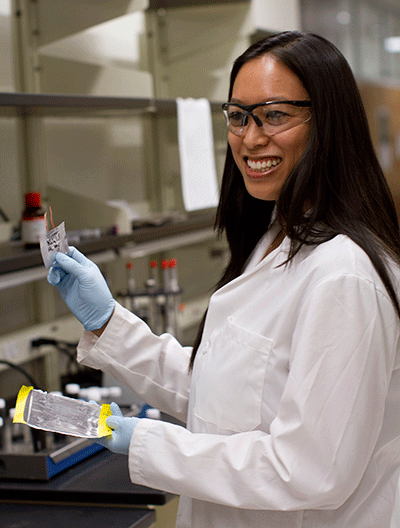 A woman conducts research in an engineering lab