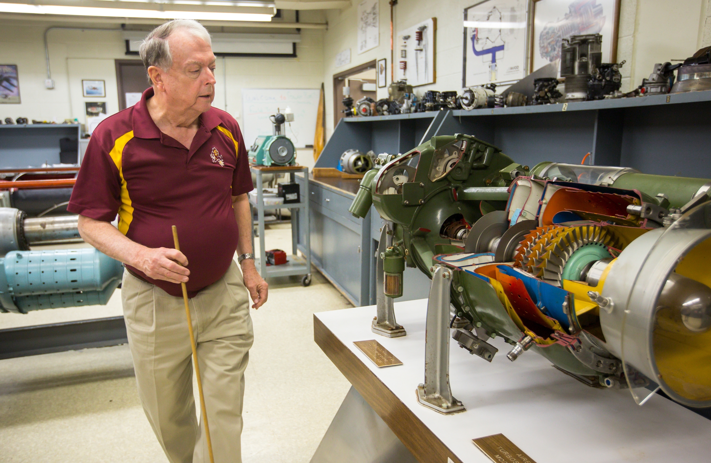 Aviation instructor Jimmy Kimberly walks in a lab.