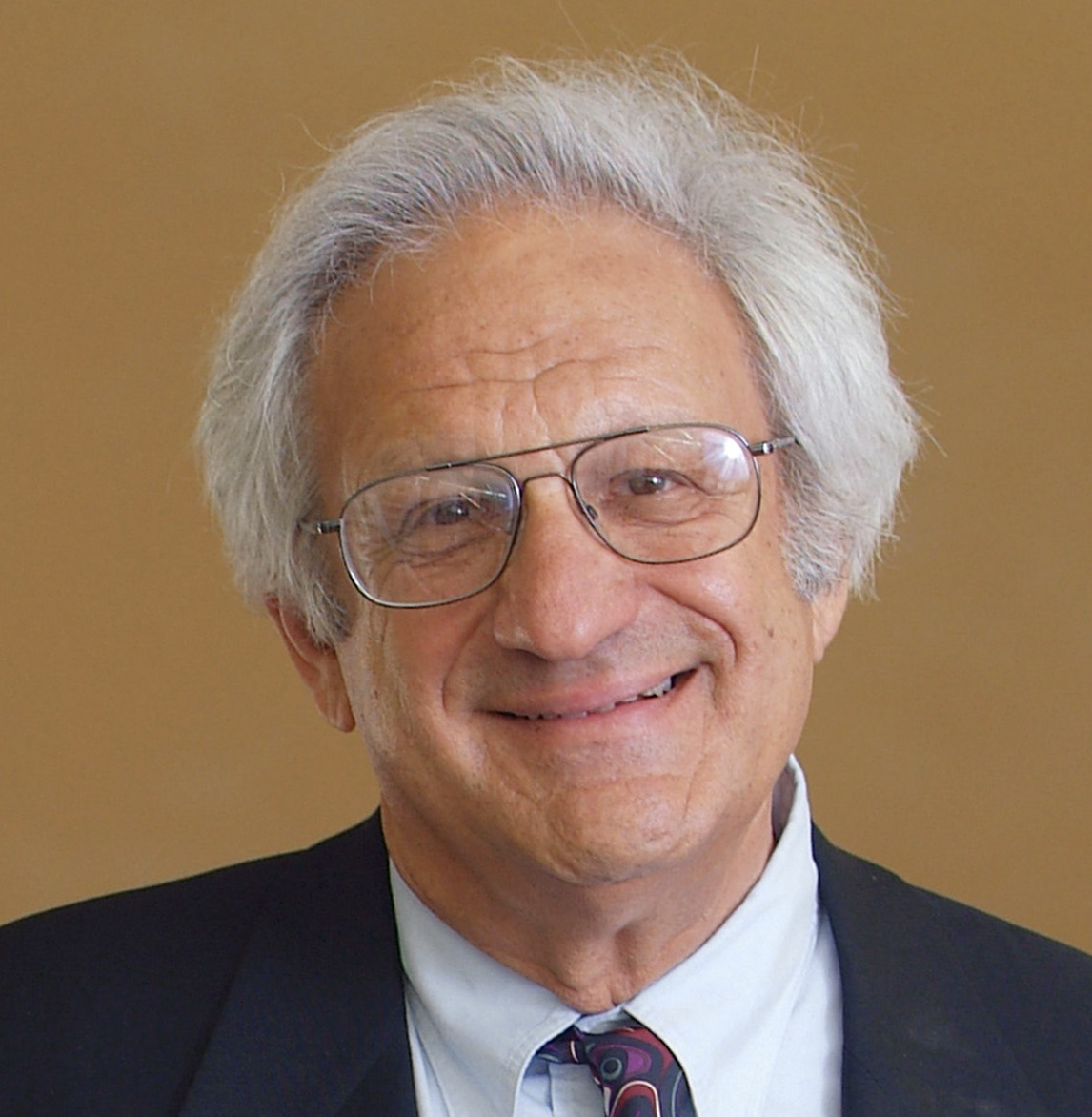 Man in glasses and tie smiling