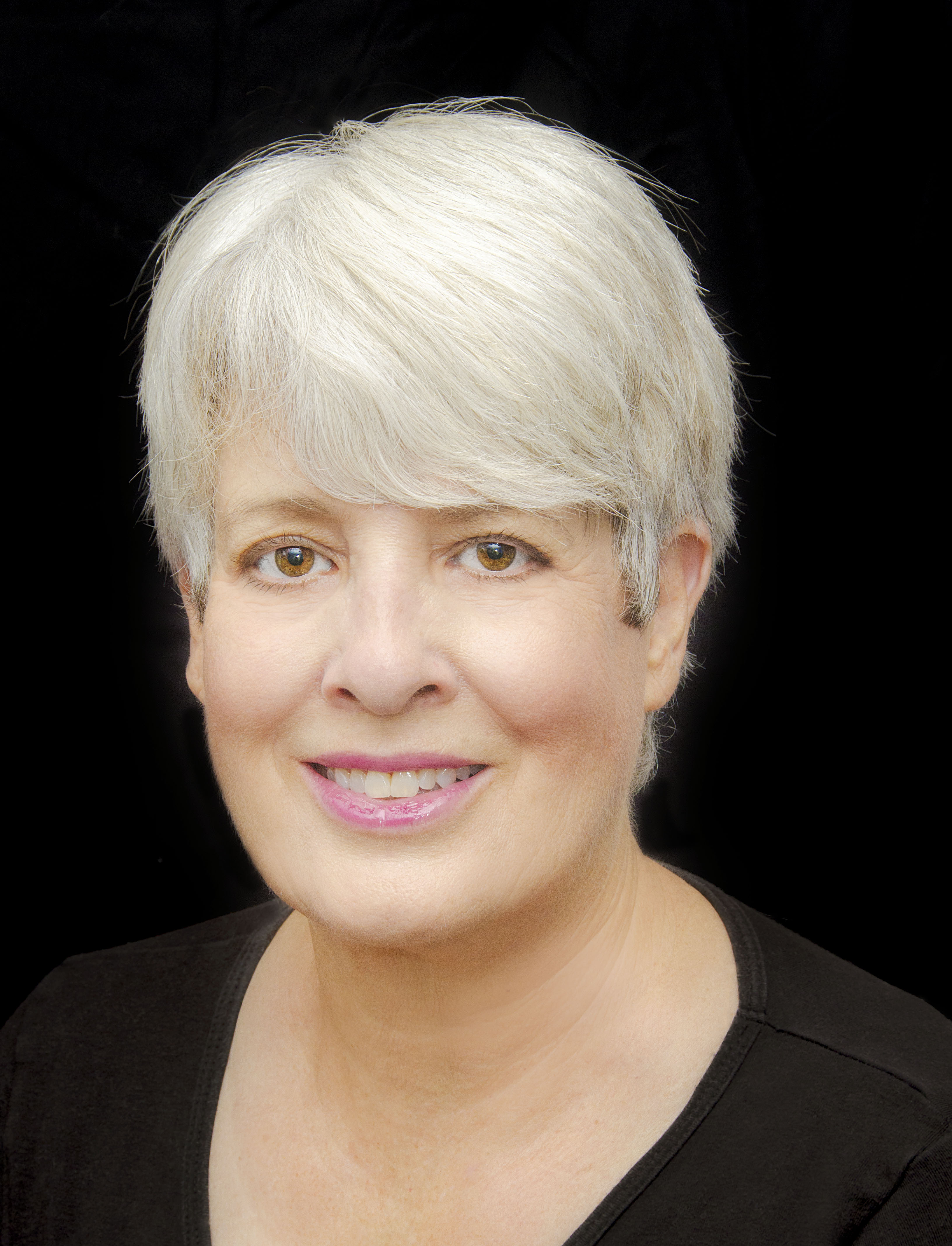 Woman with gray hair and smiling