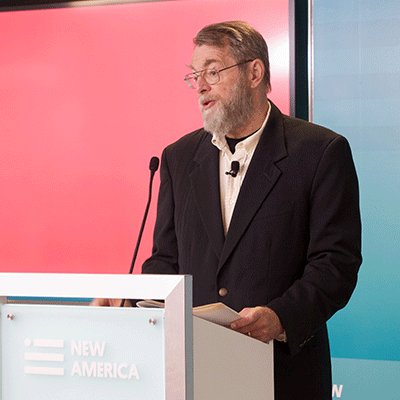A man speaks at a lectern