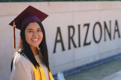 woman posing in graduation cap