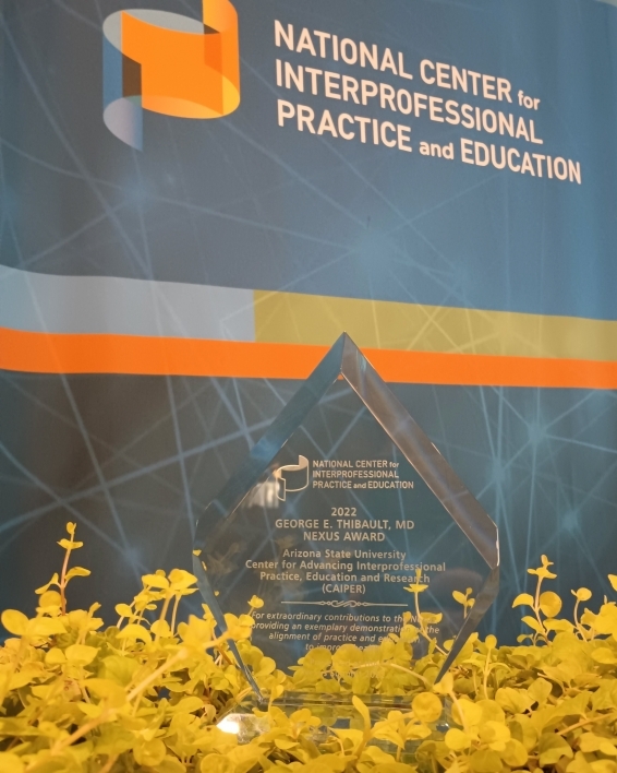 Close-up of the 2022 George E. Thibault, MD Nexus Award, awarded to ASU's Center for Advancing Interprofessional Practice, Education and Research.