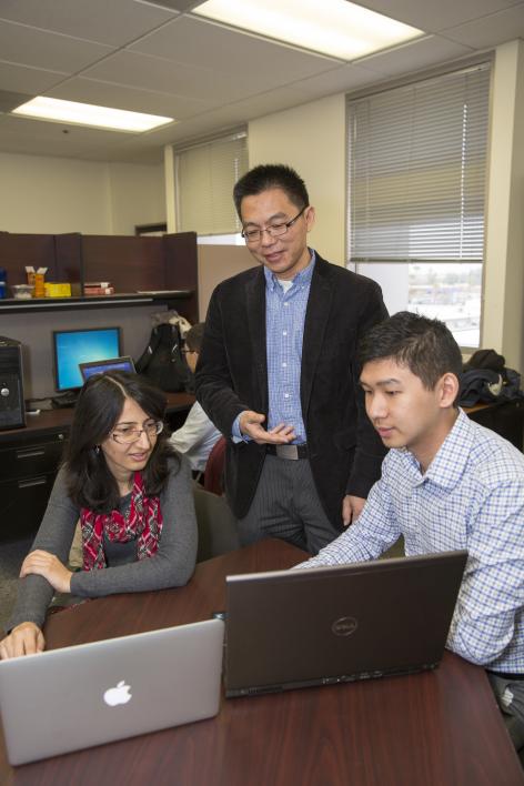 Professor Junshan Zhang, principal investigator of the grant, is creating a suite of forecasting algorithms to better account for renewable sources at all levels of the power grid operation process. Photographer: Jessica Hochreiter/ASU