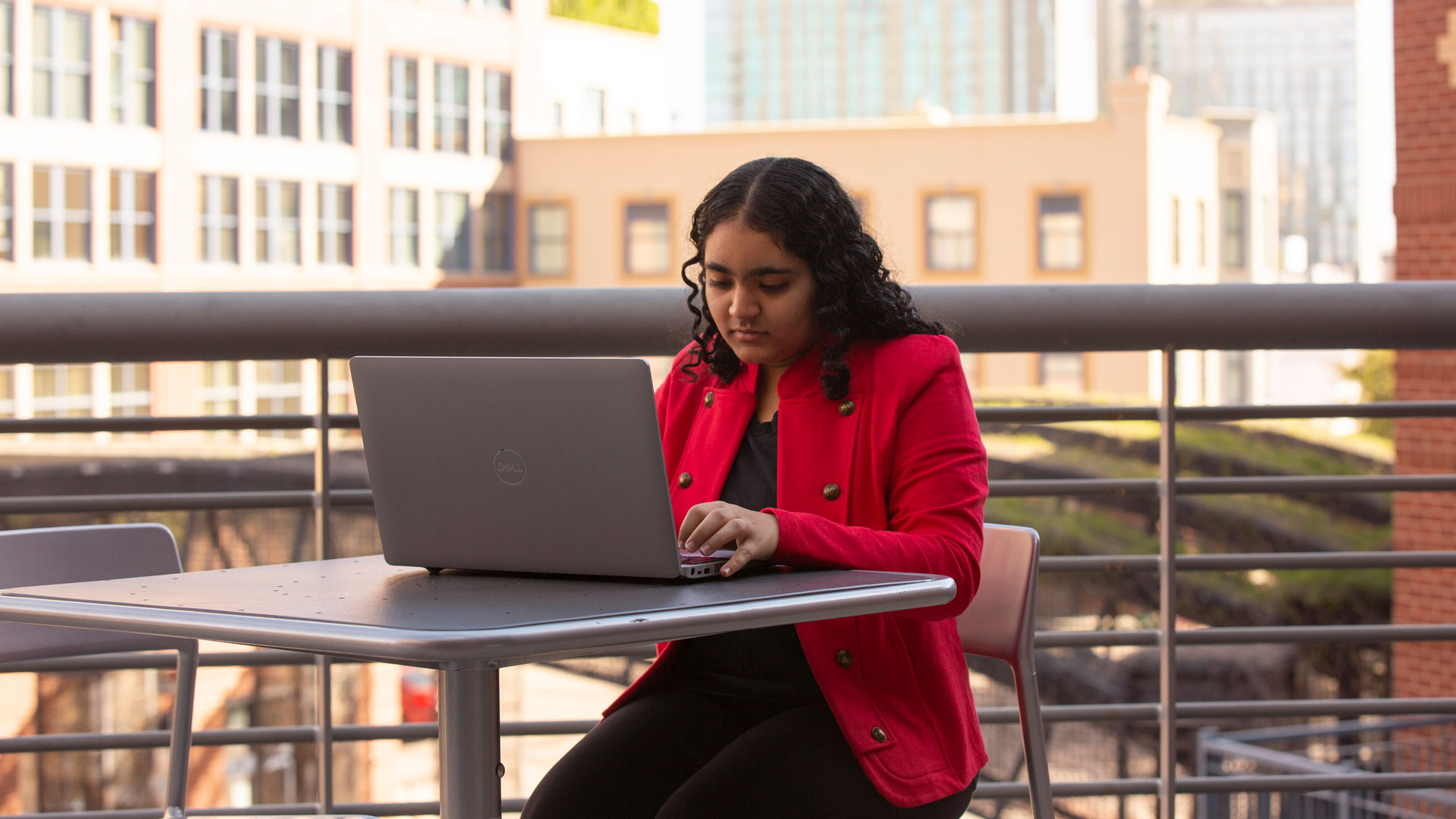 Computer systems engineering student Tina Sindwani works on a laptop.