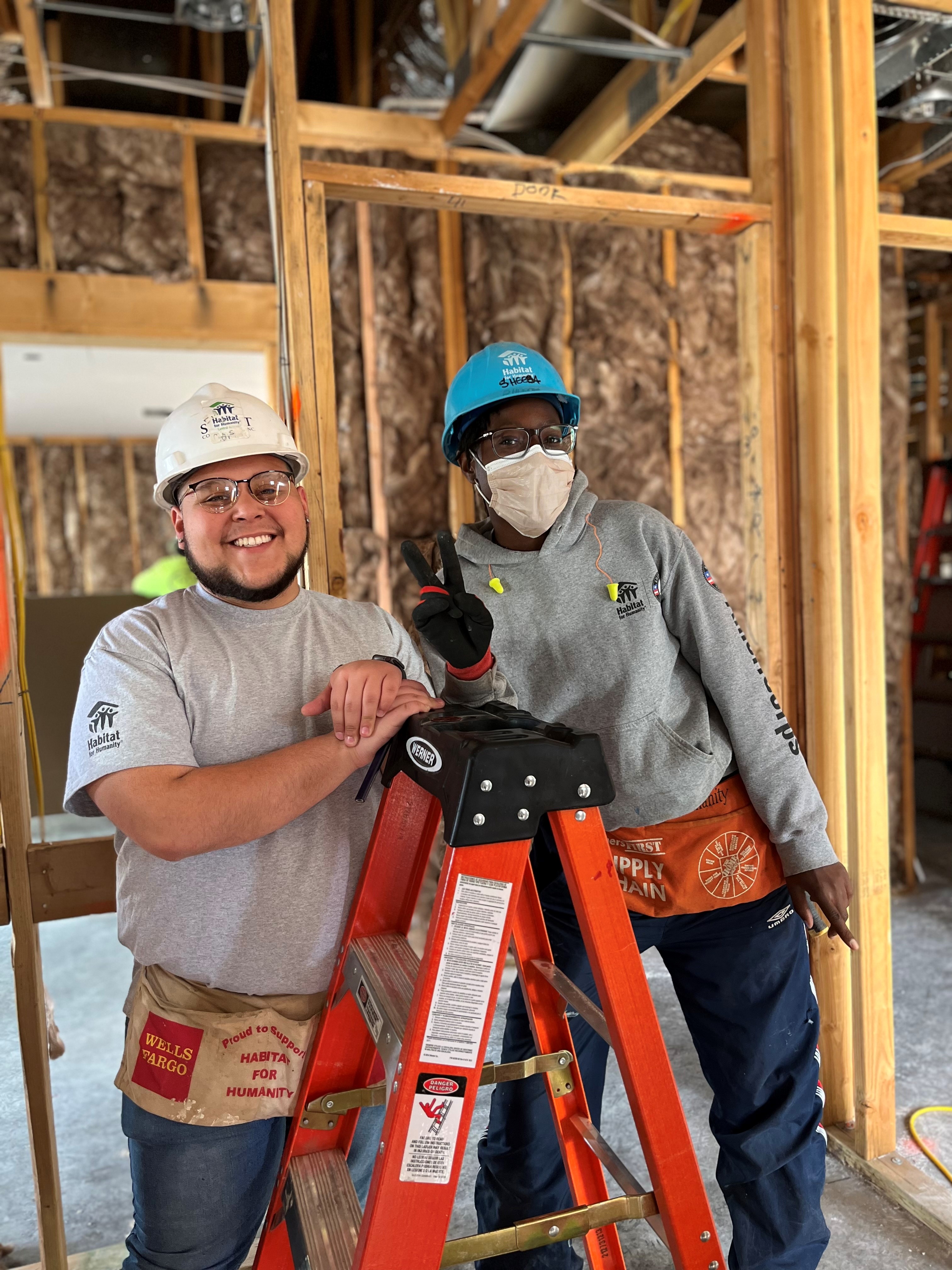 Mejia participating in a Habitat for Humanity event