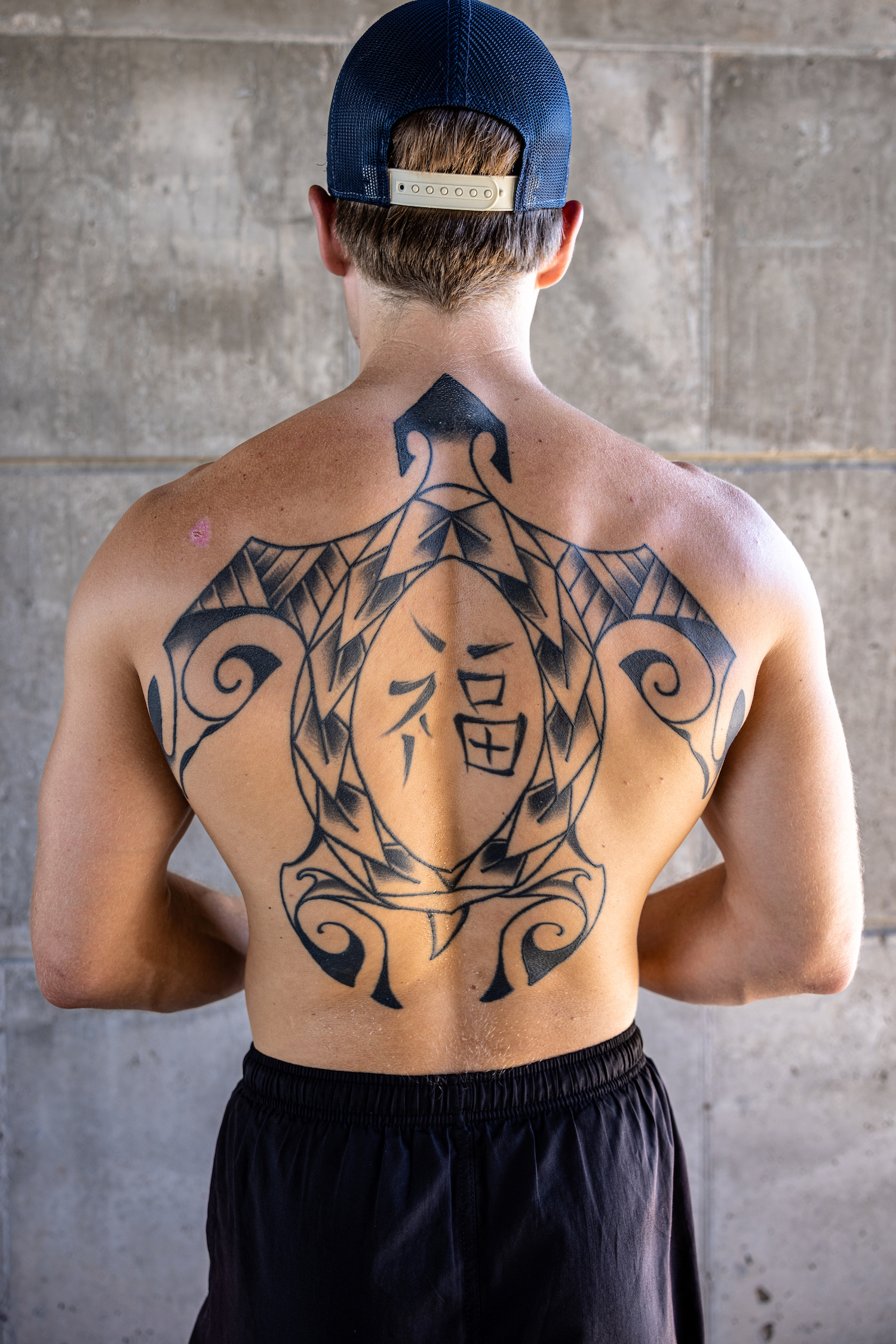 Man with back tattoo