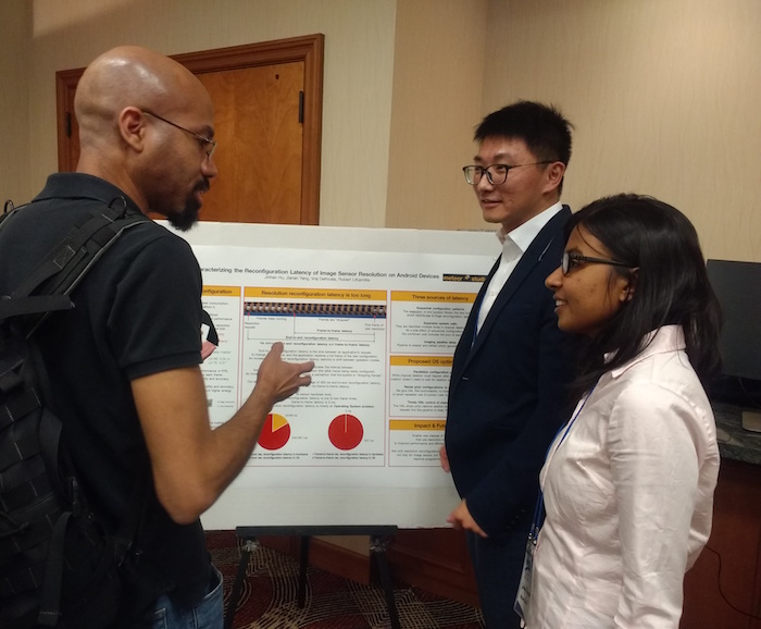 3 people talking about poster presentation