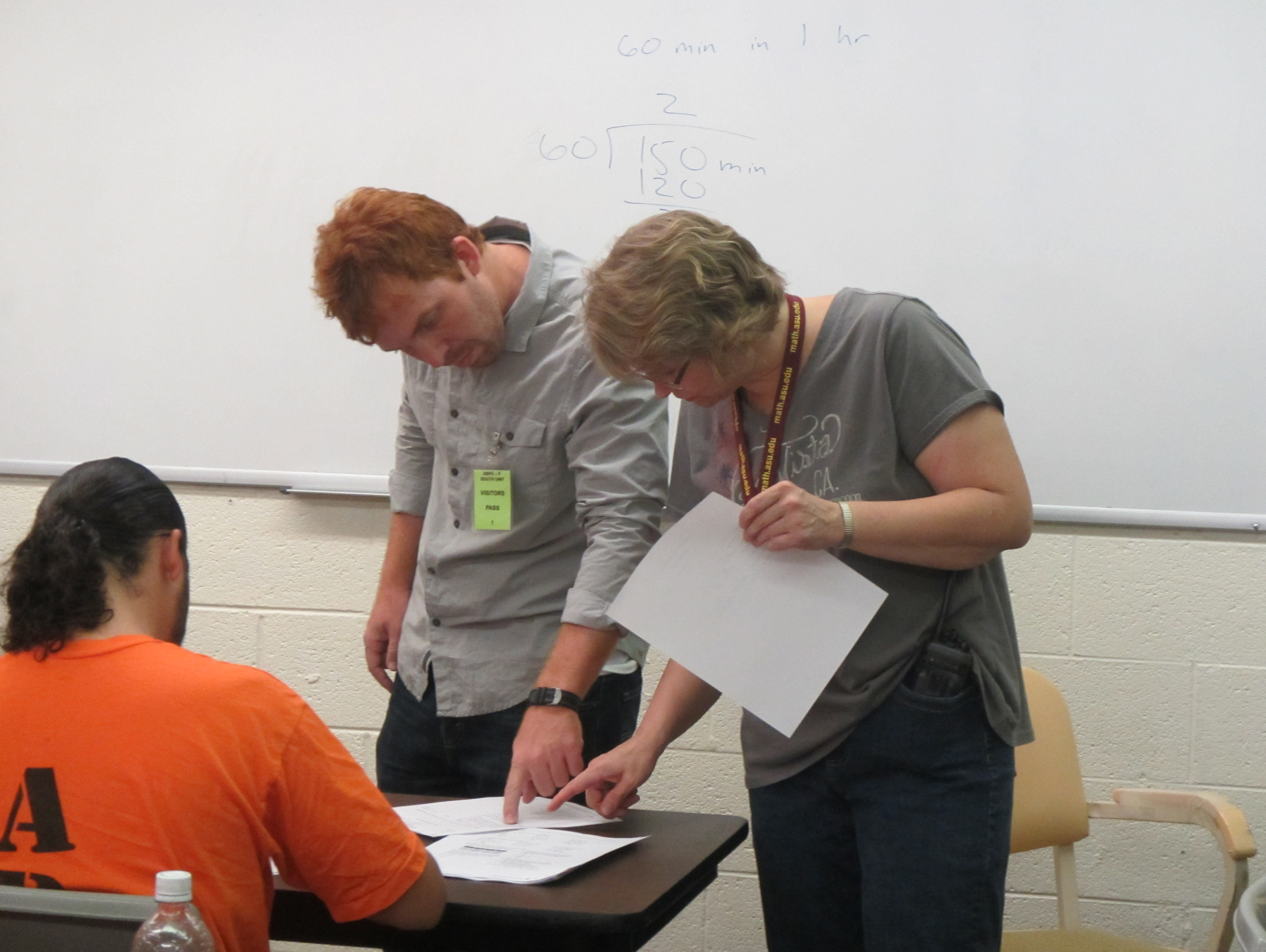 ASU teachers help an inmate with math homework