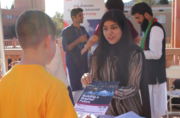 Farah Akram explains to members of the public what USAID’s mission is in Pakistan at Tempe Night of the Open Door. Photographer Erika Gronek/ASU