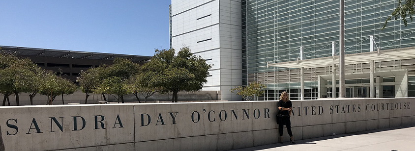 Hannah in front of the Sandra Day O'Connor Courthouse