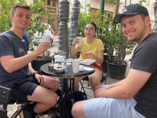 SCETL students eat at a cafe in Israel