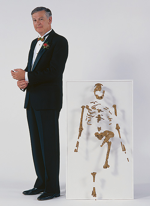 Donald Johanan stands with the skeleton Lucy that he discovered.