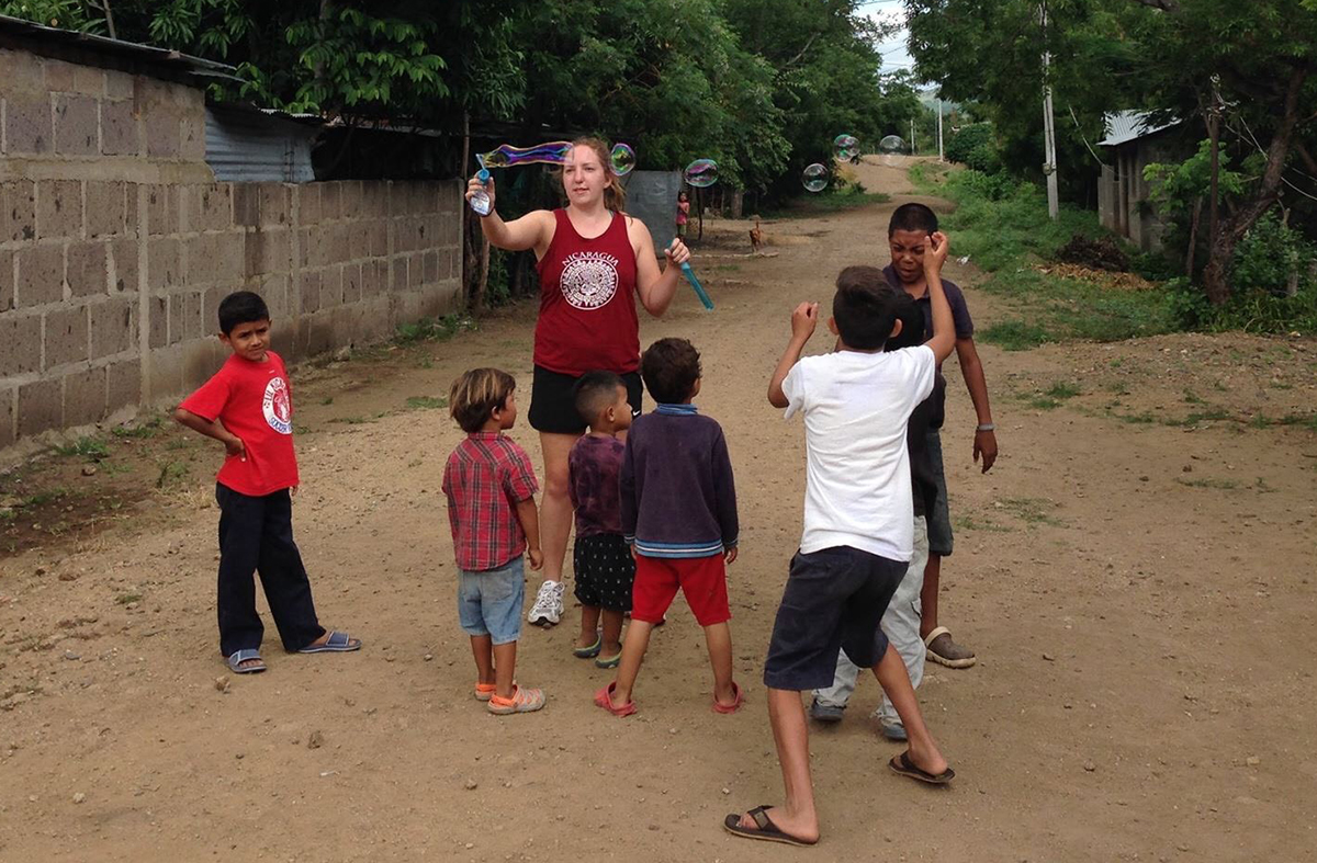 Kourtney Conn plays with kids in Nicaragua