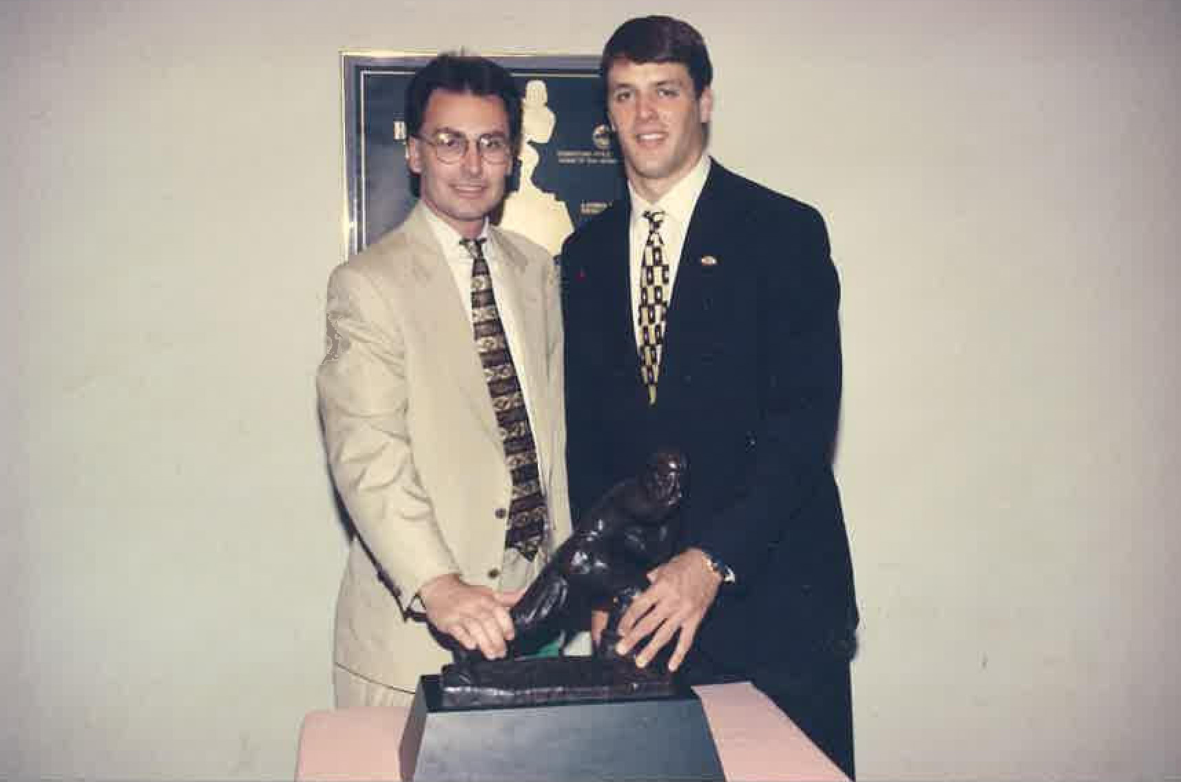 Mark Brand and Jake Plummer with Heisman trophy in 1996