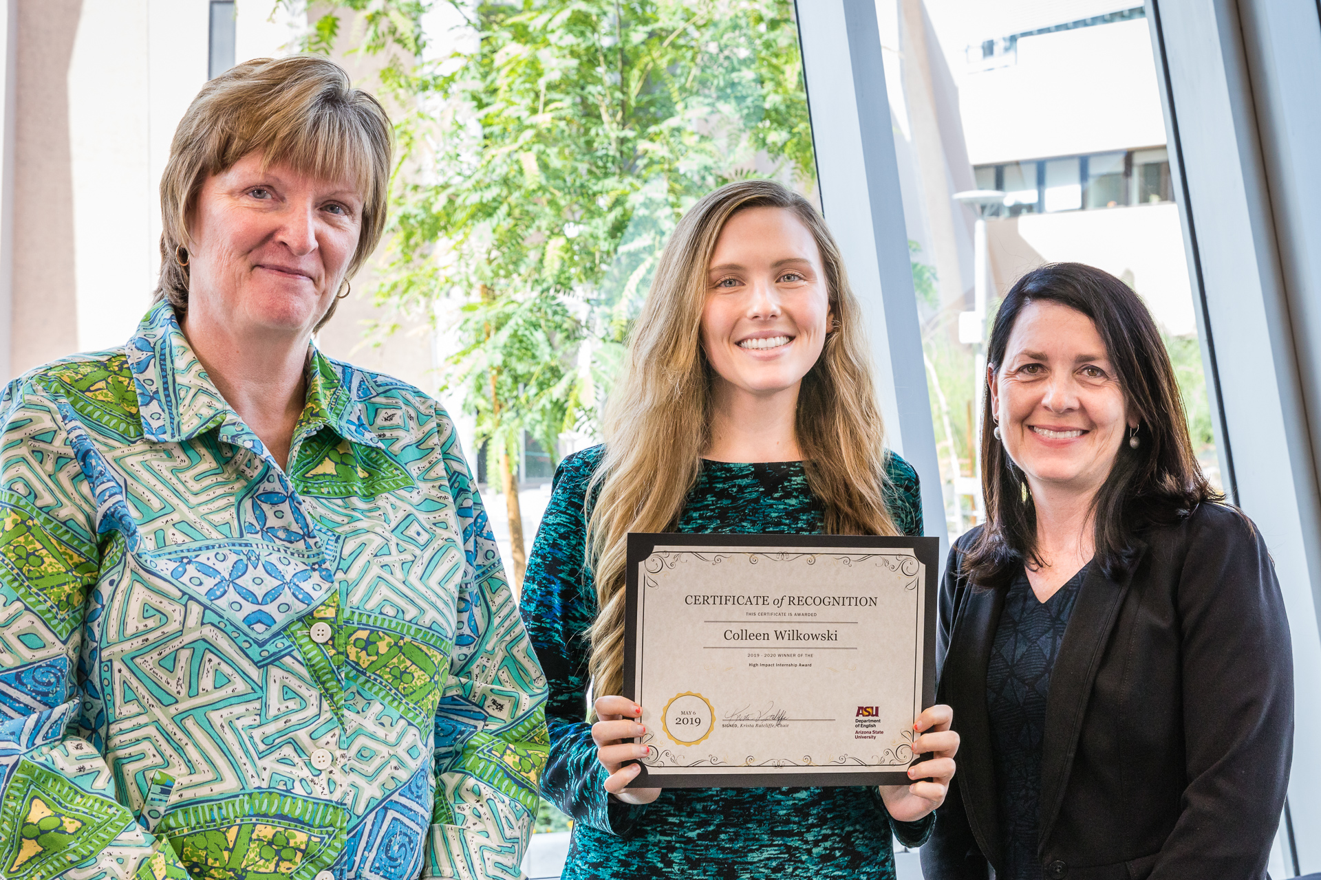 Collen Wilkowski was one of two recipients (with Easley) of the inaugural High Impact Internship Award from the Department of English in 2019. Here, she receives her award from English Chair Kris Ratcliffe (left) and Associate Chair Doris Warriner (right)