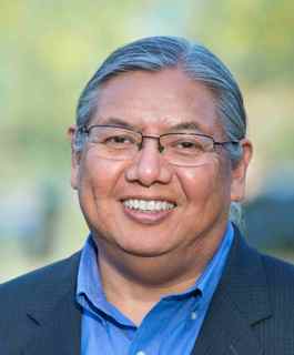 portrait of , who oversees intergovernmental affairs between ASU and tribal nations and communities