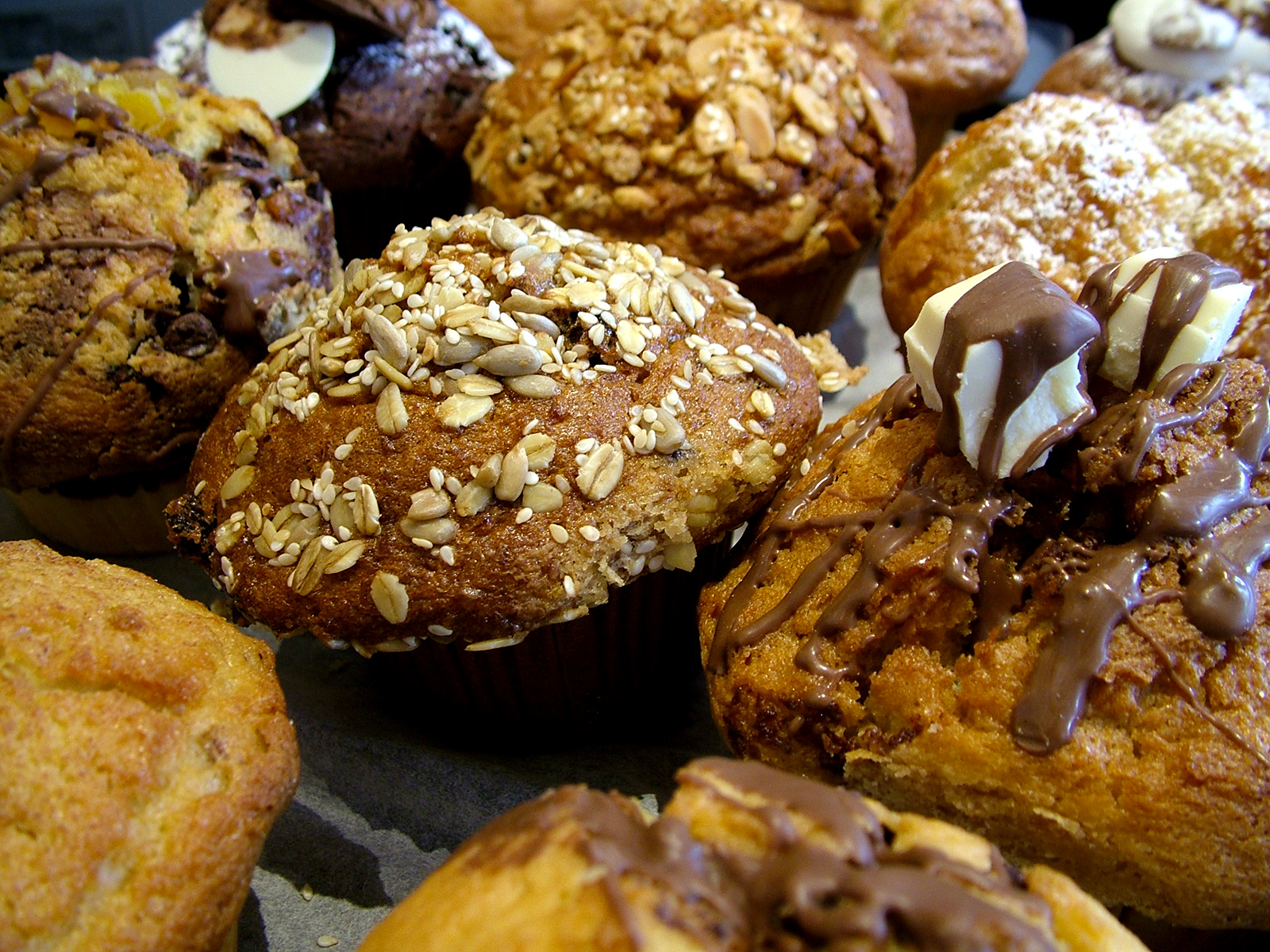 A platter of muffins and baked goods.