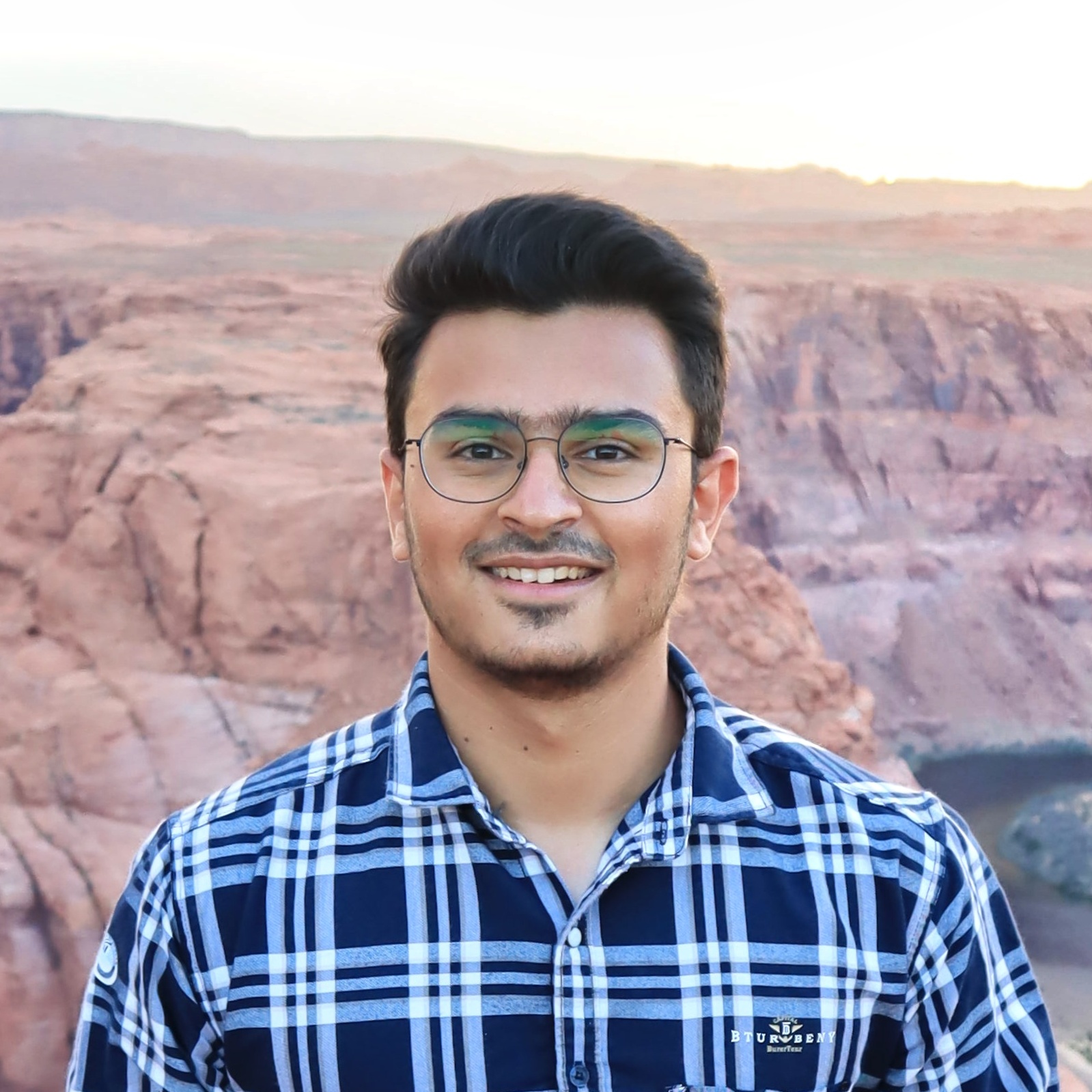 Portrait of a student in front of red rocks
