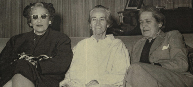 Chilean poet-diplomat Gabriela Mistral, Spanish lawyer and politician Victoria Kent and Argentine writer and intellectual Victoria Ocampo sitting on a couch