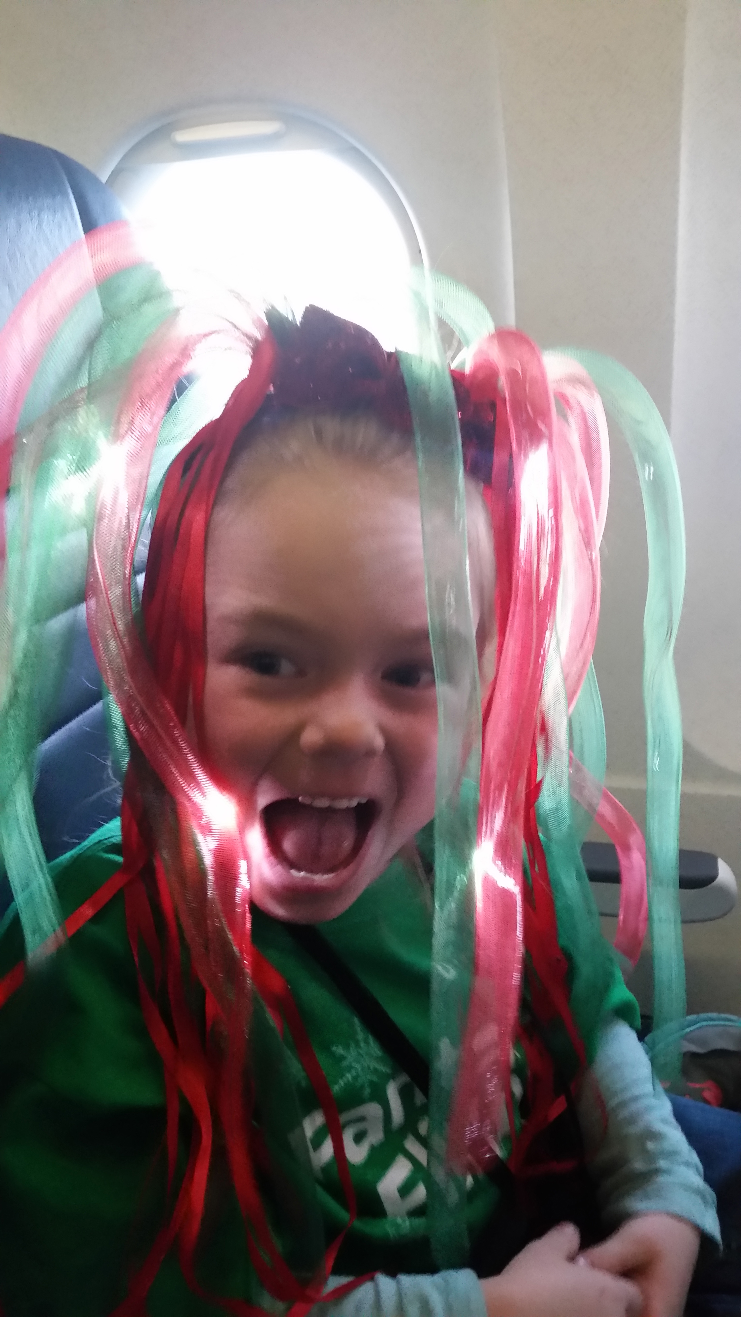 A little girl wears a glowing headband.