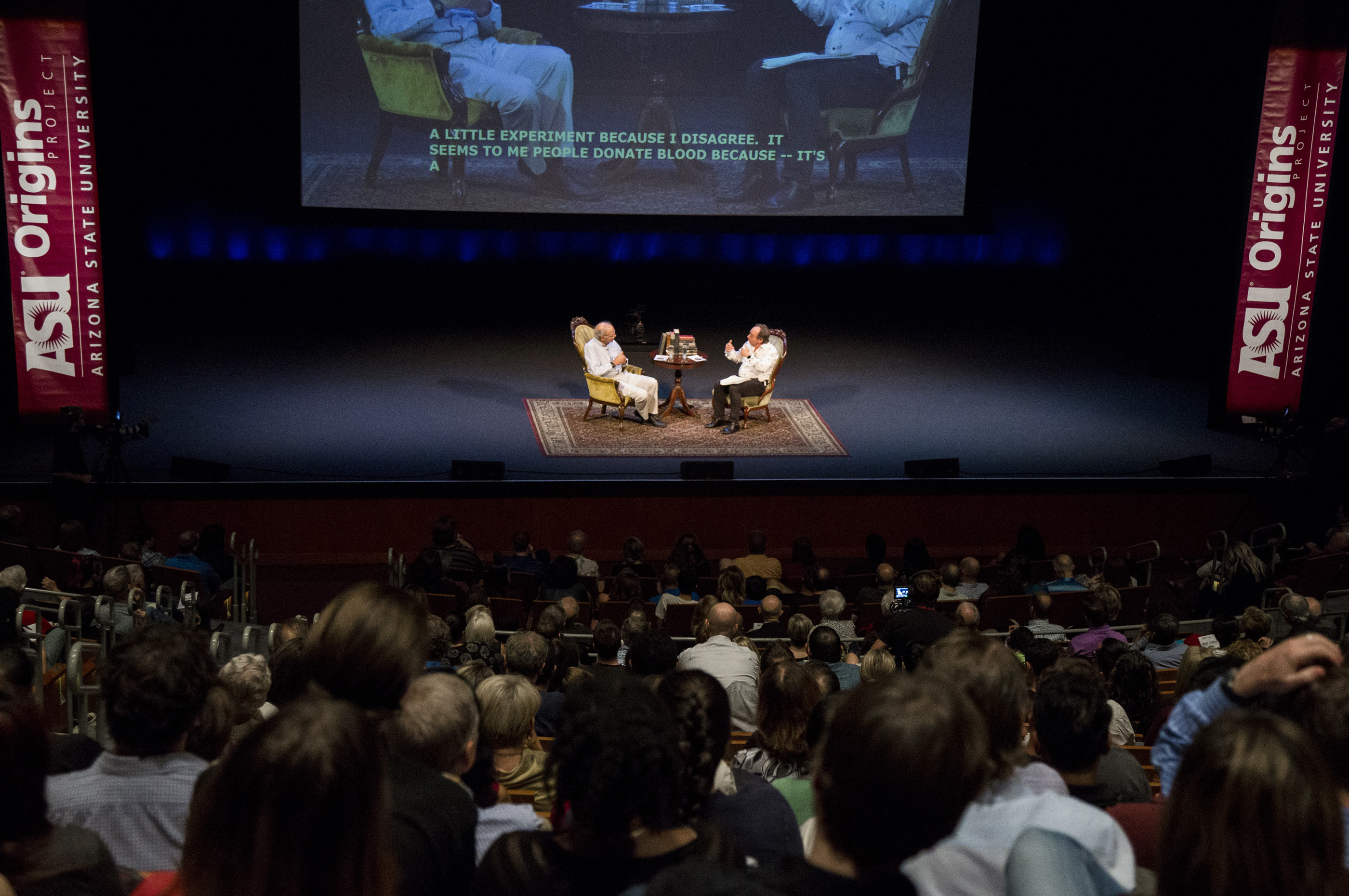 Animal-rights philosopher Peter Singer and theoretical physicist Lawrence Krauss on stage
