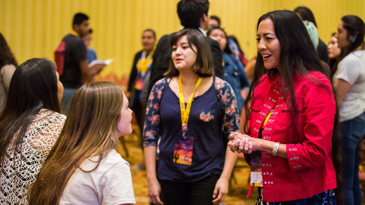 Mary Kim Titla speaks with students at a UNITY conference
