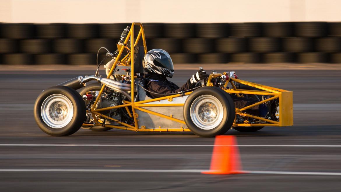 Students test drive their Formula SAE race car on the track.