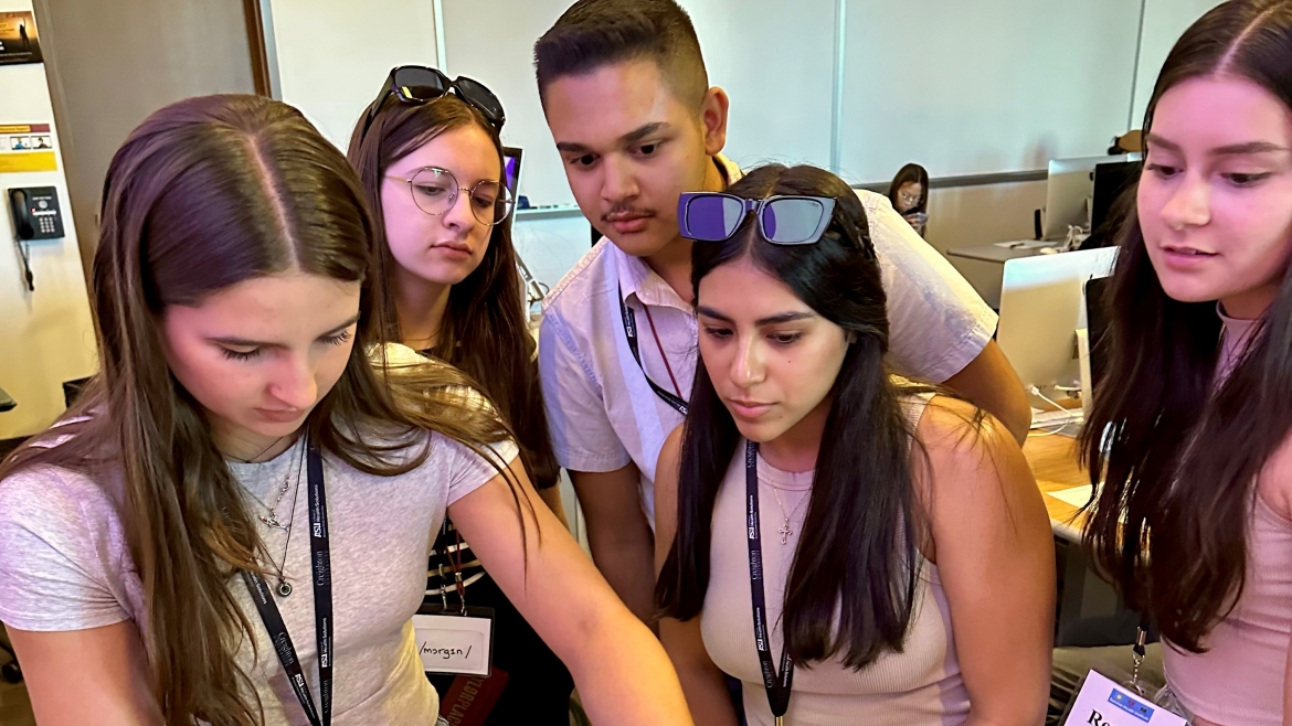 High school students practice intubation on a manikin at ASU's Summer Health Institute.