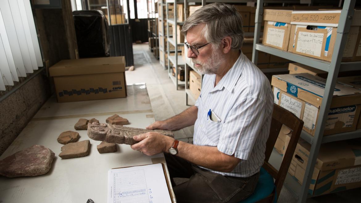 ASU professor Michael E. Smith looks at ancient objects in the Teotihuacan Research Laboratory in Mexico