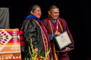 Professor presents the Dean’s Medal to American Indian Studies graduate