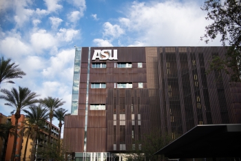 A multistory building with an ASU sign near its top