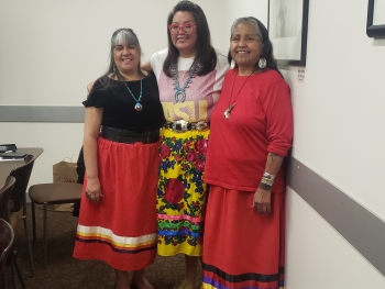 ASU alum Kelly Vallo wears a red ribbon skirt signifying her membership in the HONOR Collective, along with fellow matriarchs Melodie Lopez and Thomasa Riva.