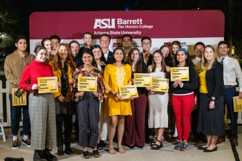 Photo of 2023 Barrett Honors College Gold Standard Award winners standing together and holding up award certificates.