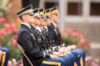 ASU Army ROTC graduating cadets seated in a row, wearing ceremonial regalia at the 2019 Spring Commissioning Ceremony.