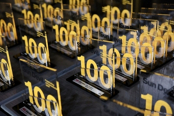 ASU Alumni Sun Devil 100 Awards laid out on a table.