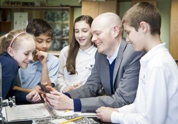 Brian David Johnson talking with students about futurism and robotics at Mater Christi School in Burlington, Vermont. 